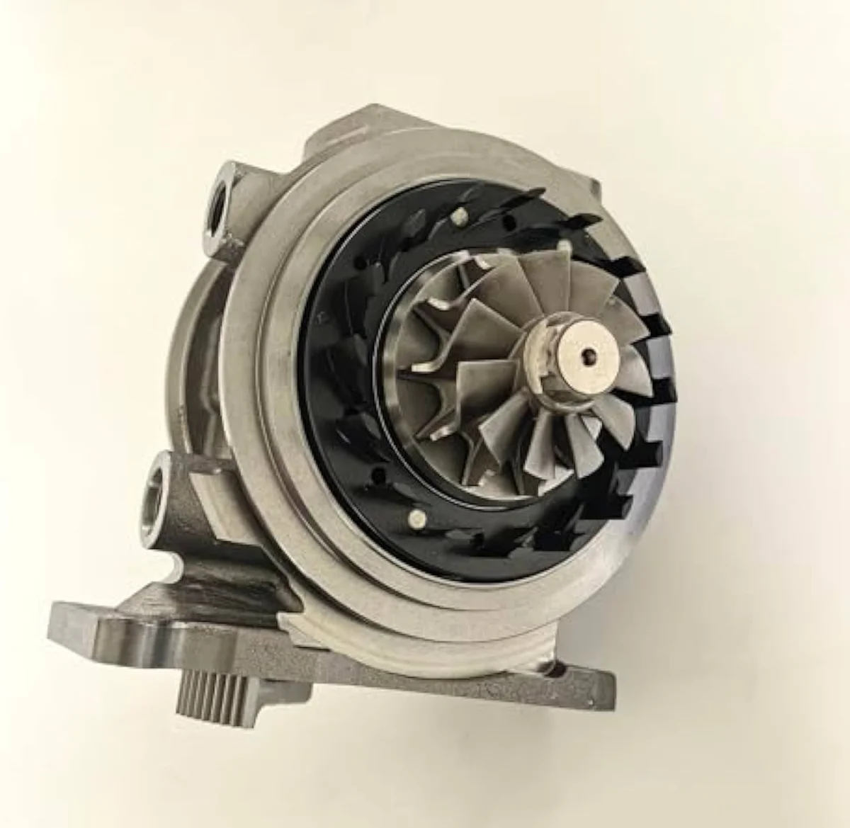 Cartridge CHRA bearing housing and shaft assembly — the rotating-assembly section that this layer replaces while keeping the compressor and turbine housings on the chassis.