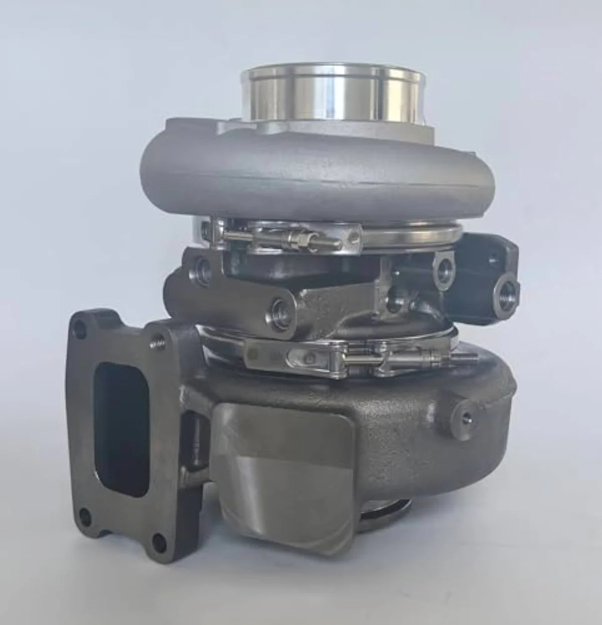 HE300VG turbocharger compressor housing detail — the smaller-frame design that replaced the HE351VE on 2013-2018 Cummins ISB chassis for tighter emissions-control modulation.